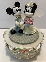 Top view of Disney Mickey & Minnie wedding music box showing figures and decorative base