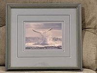 Front view of framed whale tail matted print in blue-gray wood frame