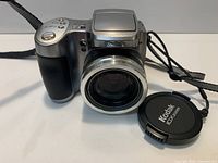 Front view of Kodak EasyShare Z740 camera with lens extended and lens cap