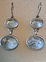 Front view of both sterling silver drop earrings showing stones and hooks
