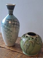 Tall and round vases side by side showing overall form and glaze