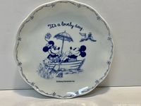 Front of plate showing Mickey & Minnie graphic and rim design