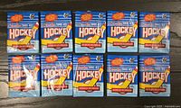 Ten sealed blue O-Pee-Chee 1991-92 NHL hockey card packs lined in two rows