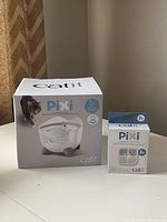 Boxed Catit Pixi fountain and filter pack front view