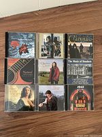 Nine CDs laid flat showing covers including Clannad, Christine Collister, The Music of Dundarn, The Celtic Heart, Your Hit Parade 1945