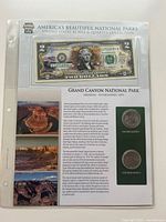 Front view of display pack showing $2 bill and two quarters