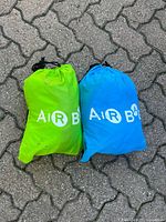 Blue and lime green storage sacks showing logo and colours
