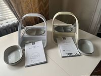 Both feeders with accessories laid out