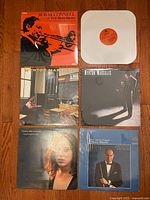 Front covers of all six vinyl LPs