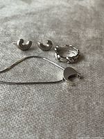 Overall view of earrings, ring and necklace