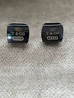 Front view showing T & CO 1837 engravings on both cufflink faces