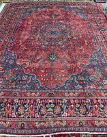 Full view of Mashhad rug showing entire field and borders