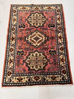 Full view of handmade Ardebil rug showing entire pattern and border