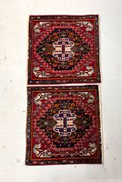 Both matching square rugs laid flat showing complete design