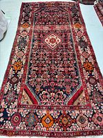 Full view of entire rug showing pattern and borders