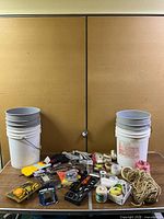 Overall lot showing buckets and assorted tools on table