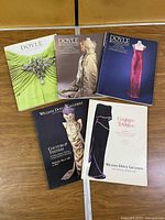 All five Doyle auction catalogues laid out face-up