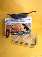 Group shot: cast-iron skillet, roast pan box, three glass dishes, red opener