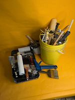 Overall lot: trays, rollers, brushes, bucket, stapler