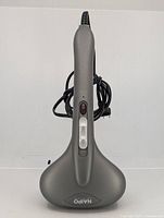 Front view standing upright showing overall massager, cord, handle controls