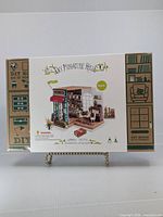 Front of sealed Simon's Coffee kit box showing illustration and branding