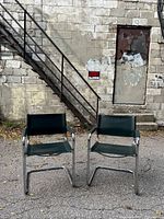 Front view of both cantilever leather armchairs