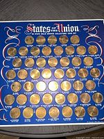 Front view of display board showing all 50 coins