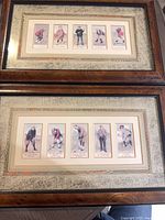 Two wood-framed displays with cigarette cards