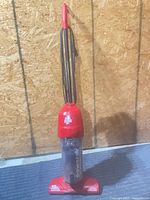 Full view of Dirt Devil Power Air stick vacuum standing upright