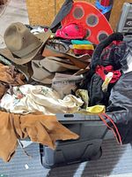 Tote with various costumes, wings, hat, accessories