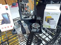 Overall lot with solar power bank box, 8-port charger box, folding mirror, three watches