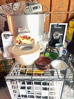 Group shot showing stock pot, Rival slicer, salad bowl, can opener, glass bowl, assorted kitchen items