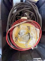 Bin containing yellow NM-B coil, red cable coil, black cables