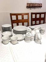 Full view of all pieces: plates, bowls, cups