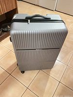 Front view showing ribbed hard-shell surface and size