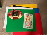 Both metal signs displayed on green board