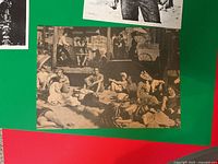 Full view of sepia-toned outdoor lounging scene photo on colored backing