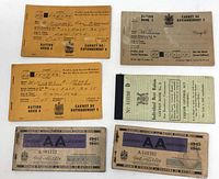 Front covers of five of the ration and coupon books showing titles, serial numbers and names