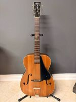 Full front view of the 1941 Martin C-1 archtop guitar on stand