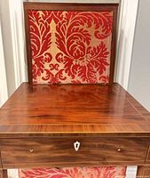 Top with firescreen raised and drawer interior detail