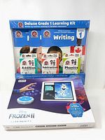 Front view of sealed Deluxe Grade 1 Learning Kit package and Kano Frozen II Coding Kit box
