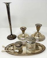 All items grouped: bud vase, two candlesticks, tray with jars and spoons