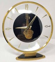 Front view showing full clock face, bezel, base, numerals, and hands