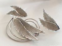 brooch and both earrings front view