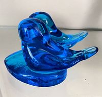 Front left view showing two blue birds on heart base