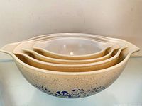 Four nested Homestead pattern bowls side profile