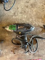 Side view of entire impact wrench with cord visible