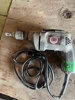 Full view of Black & Decker corded drywall screwdriver with wrapped cord