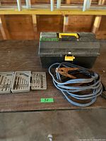 Overall lot showing toolbox, drill bit trays, cable with clamps