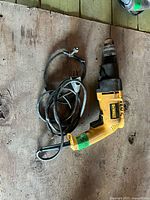 Full view of DeWalt DW505 hammer drill with coiled power cord